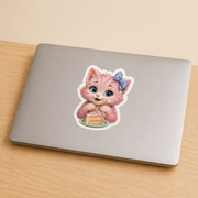 Representative Cake Smudge Face sticker on a clean dry smooth closed laptop surface; surface and device not included — The Fluffy Fam