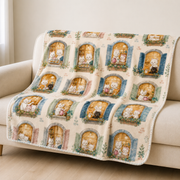 Representative sofa scene with Cozy Windows Repeat fleece blanket printed face visible