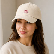 Representative adult model wearing the Cream Pink Bow Mini Embroidery Dad Hat; model/wardrobe not included