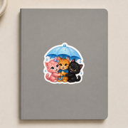 Tiny Umbrella Patrol die-cut sticker, representative application on a clean, dry, smooth closed notebook; notebook not included